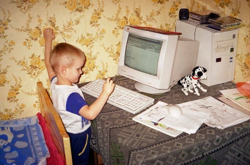 Ethereum founder VitalikButerin at the computer as a kid with his favorite stuffed dog Rastopyry