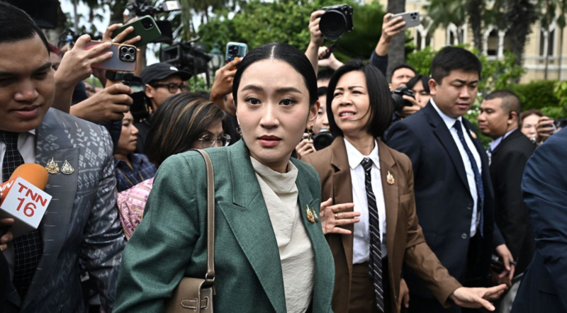 Thailand’s prime minister suspended over leaked phone call with former strongman Thailand's Prime Minister Paetongtarn Shinawatra walks through Government House after a cabinet meeting in Bangkok on July 1, 2025. Thailand’s embattled prime minister was suspended from duty Tuesday and could face dismissal pending an ethics probe over a leaked phone call she had with Cambodia’s powerful former leader. Paetongtarn Shinawatra, 38, has only held the premiership for 10 months after replacing her predecessor, who was removed from office. Her suspension brings fresh uncertainty to the Southeast Asian kingdom, which has been roiled by years of political turbulence and leadership shake-ups. Thailand’s Constitutional Court accepted a petition brought by a group of 36 senators who accused Paetongtarn of violating the constitution for breaching ethical standards in the leaked call, which was confirmed as authentic by both sides. The court voted to suspend Paetongtarn from her prime ministerial duties until it reaches a verdict in the ethics case. Paetongtarn will remain in the Cabinet as culture minister following a reshuffle. Paetongtarn has faced increasing calls to resign, with anti-government protesters taking to the streets of the capital Bangkok on Saturday, after the leaked call with Cambodia’s Hun Sen over an escalating border dispute sparked widespread anger in the country. The scandal prompted the Bhumjaithai party, a major partner of the prime minister’s government, to withdraw from the coalition last week, dealing a major blow to her Pheu Thai party’s ability to hold power. Paetongtarn is also contending with plummeting approvals ratings and faces a no-confidence vote in parliament. Related article How a leaked phone call between a former strongman and a young leader could topple a government In the leaked call, which took place on June 15, Paetongtarn could be heard calling former Cambodian strongman Hun Sen “uncle” and appeared to criticize her own army’s actions after border clashes led to the death of a Cambodian soldier last month. The Thai prime minister could be heard telling Hun Sen that she was under domestic pressure and urged him not to listen to the “opposite side,” in which she referred to an outspoken Thai army commander in Thailand’s northeast. She also added that if Hun Sen “wants anything, he can just tell me, and I will take care of it.” Her comments in the leaked audio struck a nerve in Thailand, and opponents accused her of compromising the country’s national interests. Following the ruling, Paetongtarn said she accepts the court’s decision and that her intention “was truly to act for the good of the country.” “I want to make it clear that my intentions were more than 100% sincere — I acted for the country, to protect our sovereignty, to safeguard the lives of our soldiers, and to preserve peace in our nation,” she said in a press conference Tuesday. “I also want to apologize to all my fellow Thais who may feel uneasy or upset about this matter,” she added. Thailand and Cambodia have had a complicated relationship of both cooperation and rivalry in recent decades. The two countries share a 508-mile (817-kilometer) land border – largely mapped by the French while they occupied Cambodia – that has periodically seen military clashes and been the source of political tensions. In the wake of the scandal, Paetongtarn tried to downplay her remarks to Hun Sen, saying at a press conference she was trying to diffuse tensions between the two neighbors and the “private” call “shouldn’t have been made public.” The prime minister said she was using a “negotiation tactic” and her comments were “not a statement of allegiance.” Paetongtarn became prime minister last year after the Constitutional Court ruled that her predecessor Srettha Thavisin had breached ethics rules and voted to dismiss him as prime minister. The same court also dissolved the country’s popular progressive Move Forward Party, which won the most seats in the 2023 election, and banned its leaders from politics for 10 years.