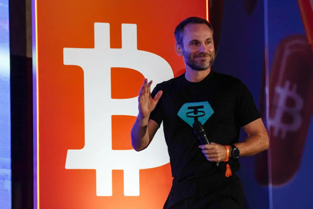 Tether Revs Up Deal Machine After Its Embrace by ‘Establishment’ Tether invested in firm in which Lutnick, Sacks owned shares Crypto firm plans to step up dealmaking as earnings rise Paolo Ardoino, the chief executive officer of $140 billion stablecoin giant Tether Holdings Ltd., had a triumphant message for the crypto faithful gathered in San Salvador late last week. The “establishment,” according to Ardoino, had unfairly maligned Tether, which has long been the target of scrutiny among authorities over the use of its token by criminals and terrorists. But that changed when Donald Trump returned to the White House with an administration packed with crypto advocates, just days before Ardoino took the stage at Tether’s annual Plan B Forum.