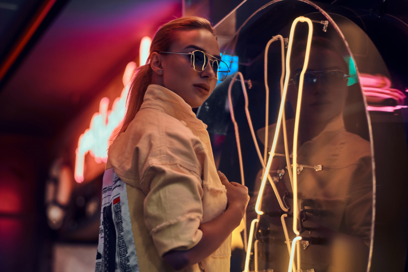 portrait-pretty-young-woman-neon-lights-with-darkness-around