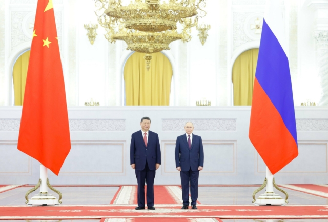 Chinese President Xi Jinping says China stands with Russia against "international bullying."