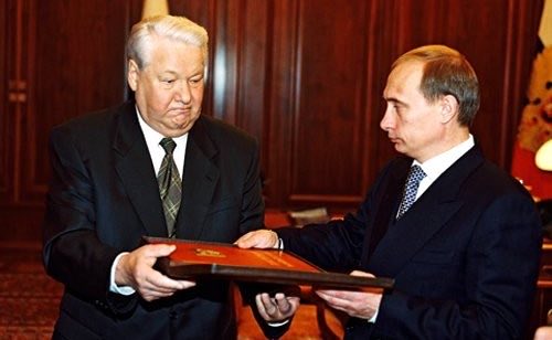 On December 31, 1999, Boris Yeltsin, the first President of the Russian Federation, steps down at the Kremlin and transfers power to Vladimir Putin.