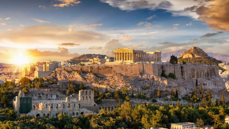 What It Means To Be Wealthy In Greece The Acropolis of Athens, Greece The Acropolis and the Parthenon Temple, Athens Greece getty Greece is more than just a holiday destination—it's an incredible place to call home, especially for those seeking financial and lifestyle advantages. It has breathtaking islands, world-class beaches, and thriving cities. Still, beyond its natural beauty, Greece boasts attractive incentives for expats, including a flat tax scheme for ultra-high-net-worth individuals, a streamlined golden visa program, and a digital nomad visa for remote workers. Plus, the cost of living remains significantly lower than in a lot of Western Europe, making luxury living more accessible. Here's what it means to be wealthy in Greece. Being Wealthy in Greece Is All About the Landscape CNTraveler listed Greece as the 10th best country in the world in the Readers' Choice Awards 2024, citing "postcard-perfect Santorini, mythology-steeped Mykonos, and massive Crete, with its reemerging viticultural scene." TripAdvisor recently labeled the latter as having the best of the best beaches—Elafonissi in Crete, famed for its pink sand and crystal clear waters, which are as attractive to hikers as to water sport enthusiasts. Aerial View Of Elafonissi Beach On The Greek Island Of Crete Elafonissi beach on the Greek island of Crete—Trip Advisor's Best of The Best Beach Winner 2025 DeFodi Images via Getty Images A record number of visitors are seeking out Greece's more under-explored islands, such as Paros, and other favorites like Hydra, Ios, Tinos, and Zakynthos. And that's not forgetting Athens itself. Indeed, CNTraveler noted the Athens Riviera as one of the 25 best places to visit in Europe in 2025. Just 30 minutes from Athens city center, this 40-mile stretch of coastline is undergoing a resurgence, driven by the completion of Europe's most extensive coastal park, planned for the end of 2025, and a raft of the most fabulous hotel chains setting up home. So, what might it mean to live in Greece, and how would your salary and wealth stack up against the country's averages and the cost of living? Being Wealthy In Greece–Greece's Average Annual Salary As reported by Euronews, workers in Greece have an average annual salary of $18,600 (€17,707), which is lower than the EU average of around $30,000 (€28,217). As a comparison, Greece's average is much lower than the highest in European countries, in Switzerland, $90,000 (€85,582), in Iceland, $56,600 (€53,885), or in Norway, $48,100 (€45,798), for instance. The lowest average annual salary in the EU is in Bulgaria and Turkey, where both are around $9,500 (€9,000). Being Wealthy In Greece–Greece's Cost Of Living When taken globally, a comparison of the cost of living in Greece is lower than it is in many other countries such as the U.S., the U.K., and France: France: $1,200 per month for a single person, not including rent. U.S.: $1,166 per month for a single person, not including rent. Canada: $1023 per month for a single person, not including rent. Italy: $905 per month for a single person, not including rent. Greece: $832 per month for a single person, not including rent. Malta: $801 per month for a single person, not including rent. Spain: $731 per month for a single person, not including rent. Thailand: $650 per month for a single person, not including rent. Portugal: $592 per month for a single person, not including rent. Furthermore, when you factor in rent, it becomes clear that Greece offers more for your dollar per square meter. Accommodation is almost 40% cheaper to rent in Greece than in France, and the cost of living is nearly 21% cheaper. Being Wealthy In Greece–A Flat Tax For UHNWIs Greece has been gradually luring ultra-high-net-worth individuals, most notably with a flat tax of $105,000 per year (€100,000). This is on global income for individuals who transfer their tax residence to Greece, provided they invest in Greek assets with a minimum value of $525,150 (€500,000). Over the past ten years, the number of millionaires in Greece has increased by 14%, and there are now 64,700 millionaires in the country. There are 105 individuals with over 100 million dollars and eight billionaires. They mostly choose to live in Attica, Mykonos, and Crete. Being Wealthy In Greece—Getting A Golden Visa Greece has recently seen a rise in American applicants for golden visas, with monthly government figures increasing from 302 to 383 by November 2024. Greece has one of the fastest golden visa processes, granting residency within 60 days. Plus, it's an attractive scheme as residency holders don't need to live in Greece to maintain their visa status, there is an unlimited expiry date, and the residence applies to the whole family (married spouses, children under 21 years old, and parents of the principal applicant and spouse). After seven years, residents on this golden visa can also apply for citizenship. Now, as per Henley & Partners, it's possible to get a golden visa by investing in real estate in several ways, such as either investing $262,500 (€250,000) to restore a listed building, say, or $420,000 (€400,000) for a property of minimum 120 meters squared. This figure jumps to $840,000 (€800,000) for properties in Athens, Thessaloniki or islands with more than 3,100 residents. The government recently increased the amounts because there have been issues with golden visa schemes leading to a hike in real estate prices for locals, particularly in Spain, where the government recently ended its golden visa scheme. In Greece, you could also take part in other investment schemes to obtain a golden visa, such as investing $525,150 (€500,000) in a public limited real estate investment company that invests exclusively in Greece or purchasing the same amount of Greek government bonds with a remaining maturity of at least three years, through a Greek credit institution. Being Wealthy In Greece—Getting A Digital Nomad Visa Many EU countries offer visas for digital nomads working for foreign companies or freelancers; Greece is no exception. You can live in Greece for one year on a digital nomad visa, provided you meet the minimum monthly income requirement of $3,676 (€3,500) per month, and your clients are not in the country. It is also possible to extend the visa for one further year. It's clear then that Greece is an attractive proposition for expats, delivering an affordable lifestyle, sometimes through a digital nomad visa or a golden visa. Plus, what it means to be wealthy in Greece is significantly lower than in other European countries and the U.S.