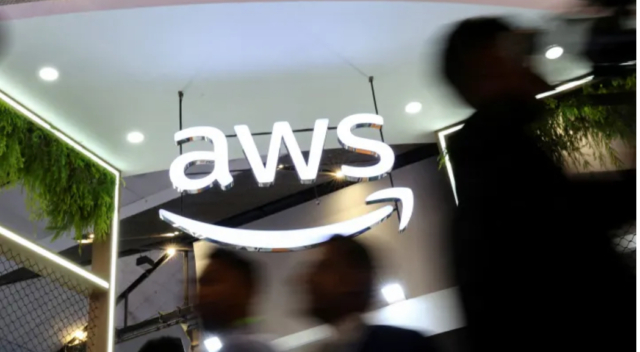 Jim Cramer says Amazon is a buy on 2025 underperformance for this key reason People walk past the logo of Amazon Web Services (AWS) at its exhibitor stall at the India Mobile Congress 2025 at Yashobhoomi, a convention and expo center in New Delhi, India, October 8, 2025.